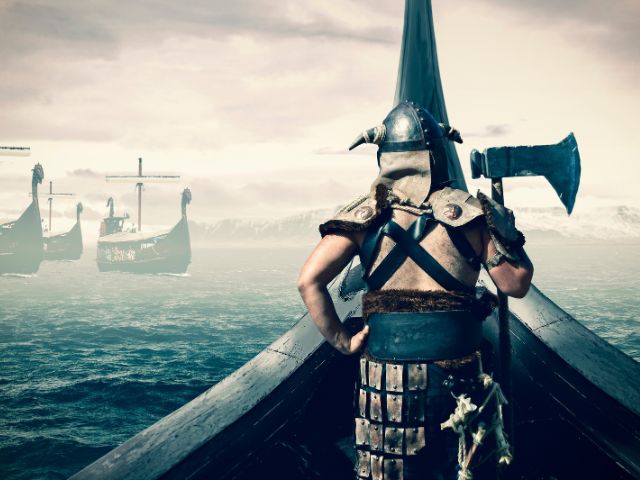 A viking warrior sailing in the sea.