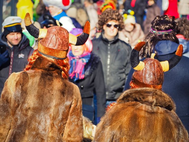 A couple wearing viking costumes in a festival.